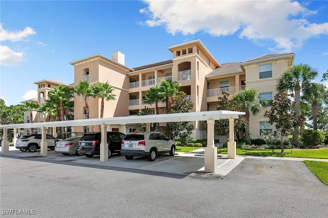 10720 Palazzo Way Unit 405, Fort Myers, FL 33913 - view of apartment building / complex with covered and uncovered parking