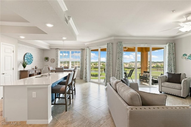 10720 Palazzo Way Unit 405, Fort Myers, FL 33913 - living area with ornamental molding, a ceiling fan, recessed lighting, light tile patterned floors, and a chandelier