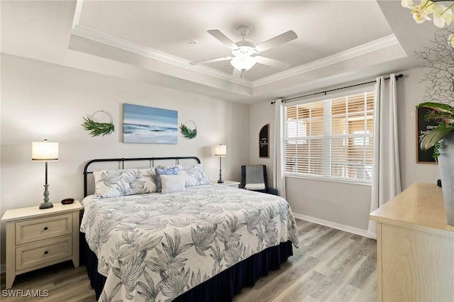 10720 Palazzo Way Unit 405, Fort Myers, FL 33913 - bedroom featuring a raised ceiling, light wood-type flooring, ornamental molding, and ceiling fan
