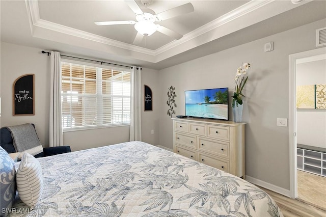 10720 Palazzo Way Unit 405, Fort Myers, FL 33913 - bedroom featuring a raised ceiling, crown molding, light wood-style floors, and ceiling fan