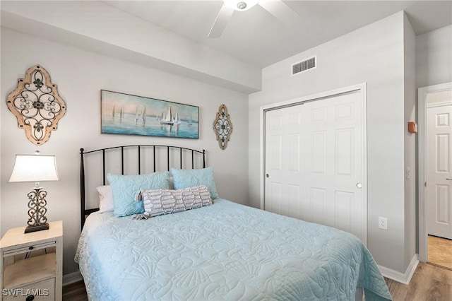 10720 Palazzo Way Unit 405, Fort Myers, FL 33913 - bedroom with wood finished floors, a closet, and a ceiling fan