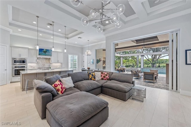 3159 Heather Glen Ct, Naples, FL 34114 - living area with a chandelier, a towering ceiling, a tray ceiling, recessed lighting, and ornamental molding