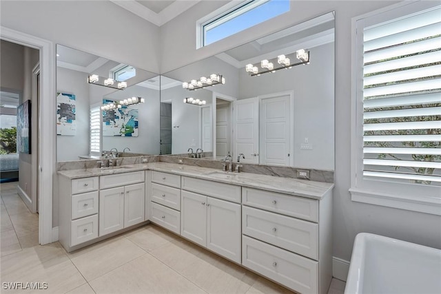 3159 Heather Glen Ct, Naples, FL 34114 - bathroom featuring a chandelier, tile patterned floors, plenty of natural light, and ornamental molding