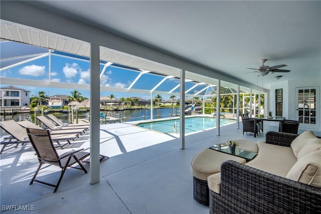 2812 SW 46th Ter, Cape Coral, FL 33914 - swimming pool with ceiling fan, a water view, a patio, a lanai, and an outdoor living space