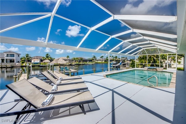 2812 SW 46th Ter, Cape Coral, FL 33914 - view of pool with a boat dock, a water view, a pool with connected hot tub, and boat lift