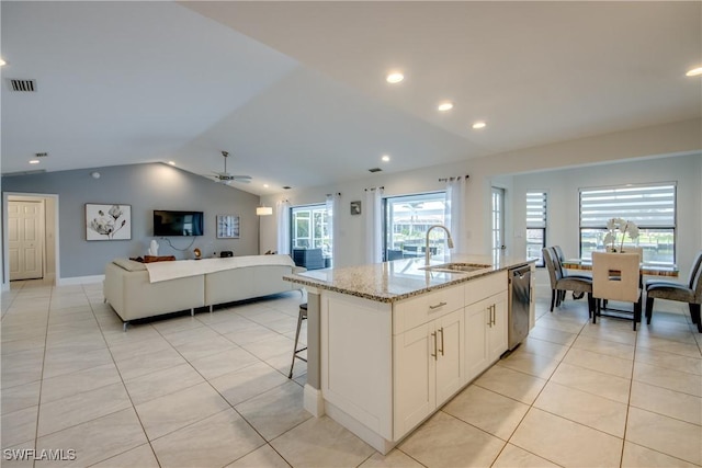 2812 SW 46th Ter, Cape Coral, FL 33914 - kitchen featuring stainless steel dishwasher, lofted ceiling, open floor plan, a kitchen island with sink, and light tile patterned flooring
