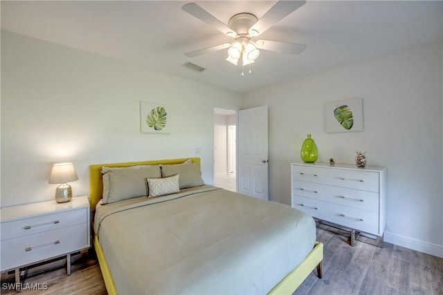 2812 SW 46th Ter, Cape Coral, FL 33914 - bedroom with wood finished floors and a ceiling fan