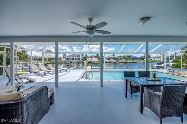 2812 SW 46th Ter, Cape Coral, FL 33914 - outdoor pool with a patio, glass enclosure, a water view, and ceiling fan
