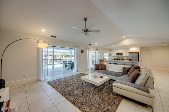 2812 SW 46th Ter, Cape Coral, FL 33914 - living room featuring lofted ceiling, a ceiling fan, light tile patterned flooring, and recessed lighting