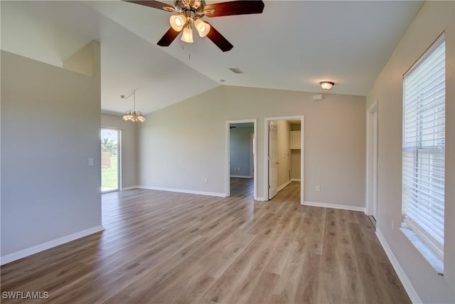 109 NE 11th St, Cape Coral, FL 33909 - empty room with vaulted ceiling, a chandelier, light wood-type flooring, and ceiling fan