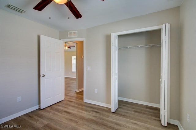 109 NE 11th St, Cape Coral, FL 33909 - unfurnished bedroom featuring wood finished floors, a closet, and ceiling fan