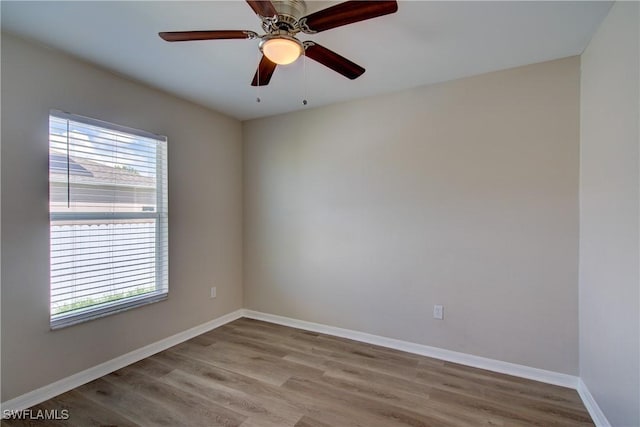 109 NE 11th St, Cape Coral, FL 33909 - spare room with plenty of natural light, wood finished floors, and ceiling fan