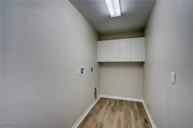 109 NE 11th St, Cape Coral, FL 33909 - laundry room featuring washer hookup, cabinet space, light wood-style flooring, and electric dryer hookup