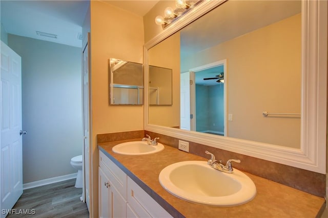 109 NE 11th St, Cape Coral, FL 33909 - bathroom with double vanity and wood finished floors