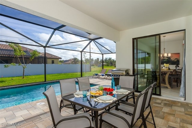 5415 Agualinda Blvd, Cape Coral, FL 33914 - view of patio / terrace featuring an outdoor pool, area for grilling, glass enclosure, and outdoor dining area