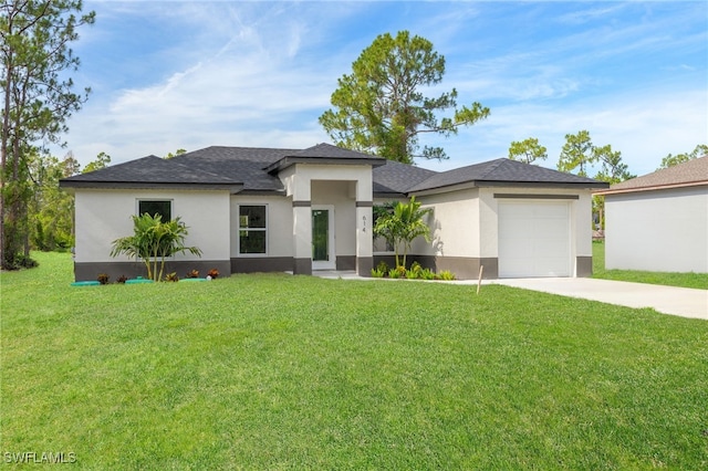 614 Ames St E, Lehigh Acres, FL 33974 - prairie-style home with stucco siding, concrete driveway, an attached garage, a front lawn, and roof with shingles