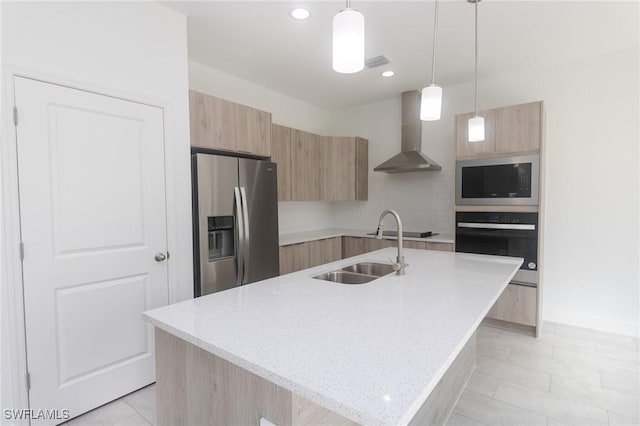 1456 Rugby Ln, Labelle, FL 33935 - kitchen featuring appliances with stainless steel finishes, modern cabinets, wall chimney range hood, light brown cabinets, and recessed lighting