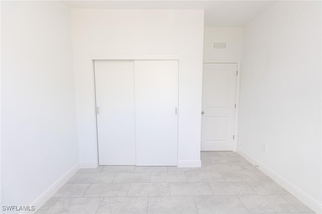 1456 Rugby Ln, Labelle, FL 33935 - unfurnished bedroom with a closet and baseboards
