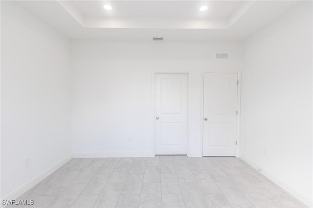 1456 Rugby Ln, Labelle, FL 33935 - spare room featuring a raised ceiling and recessed lighting