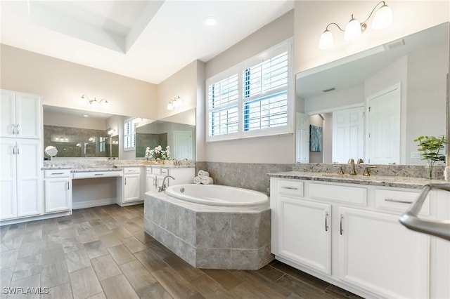 1387 Mockingbird Dr, Naples, FL 34120 - bathroom featuring plenty of natural light, two vanities, and a garden tub