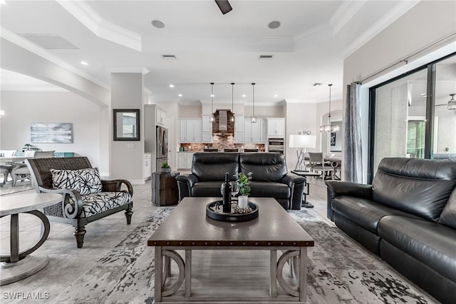 1387 Mockingbird Dr, Naples, FL 34120 - living area with a raised ceiling, crown molding, a chandelier, recessed lighting, and arched walkways