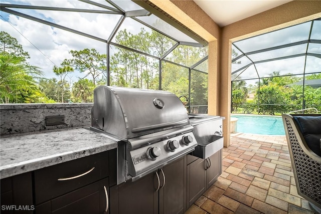 1387 Mockingbird Dr, Naples, FL 34120 - view of patio with area for grilling, an outdoor pool, and glass enclosure