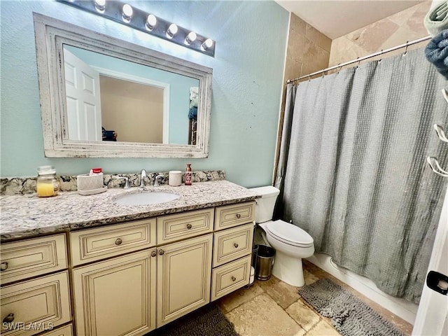3307 33rd St W, Lehigh Acres, FL 33971 - bathroom featuring vanity, a shower with shower curtain, and stone finish floors