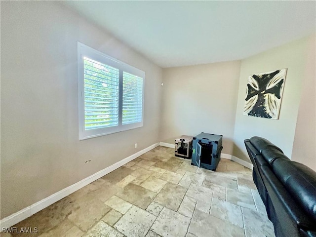3307 33rd St W, Lehigh Acres, FL 33971 - unfurnished office with baseboards and stone tile floors