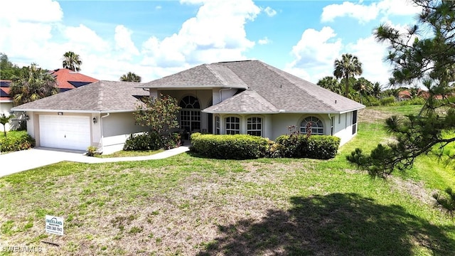 619 Charles Sise St, Lehigh Acres, FL 33974 - view of front of property featuring stucco siding, a front yard, a garage, concrete driveway, and a shingled roof