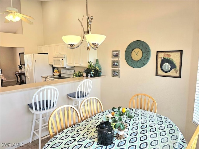619 Charles Sise St, Lehigh Acres, FL 33974 - tiled dining area with a high ceiling and ceiling fan