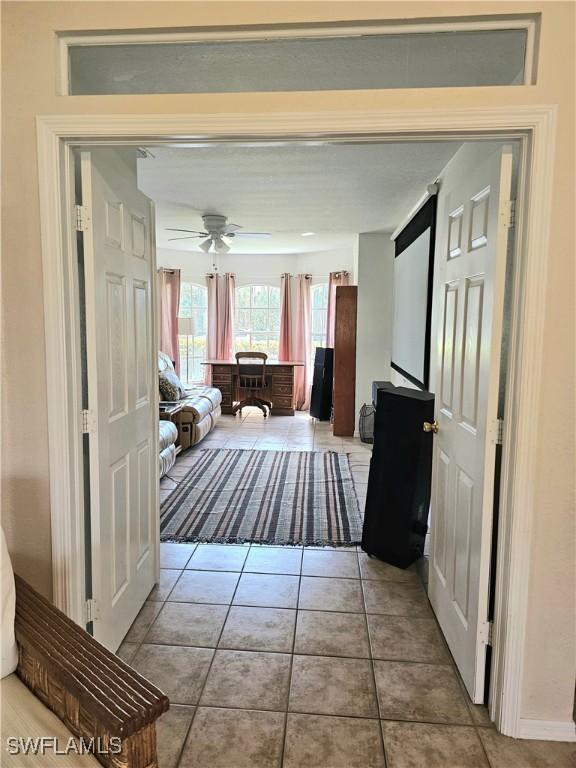 619 Charles Sise St, Lehigh Acres, FL 33974 - hall featuring tile patterned flooring