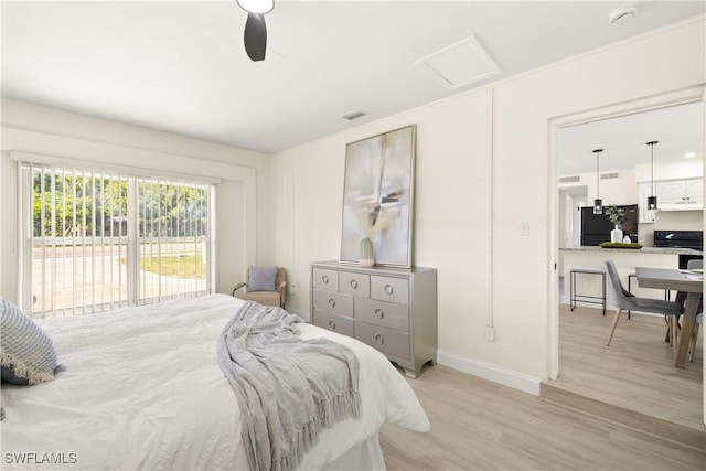 207 Leeland Heights Blvd W, Lehigh Acres, FL 33936 - bedroom with freestanding refrigerator, light wood finished floors, access to exterior, attic access, and ceiling fan