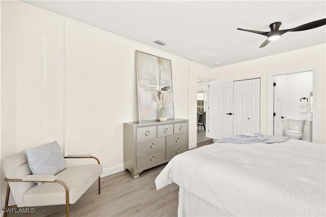 207 Leeland Heights Blvd W, Lehigh Acres, FL 33936 - bedroom featuring light wood-style flooring, ensuite bath, a ceiling fan, and attic access