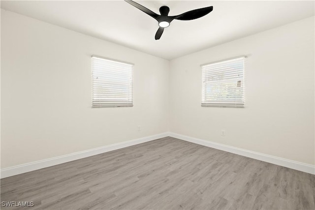207 Leeland Heights Blvd W, Lehigh Acres, FL 33936 - spare room featuring wood finished floors and ceiling fan