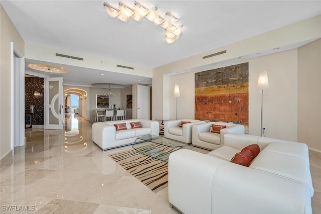 940 Cape Marco Dr Unit 1603, Marco Island, FL 34145 - living room featuring arched walkways and marble tiled flooring