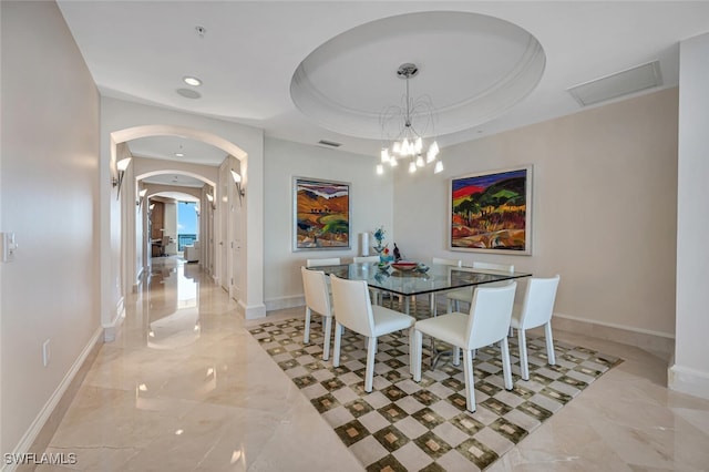 940 Cape Marco Dr Unit 1603, Marco Island, FL 34145 - dining area featuring arched walkways, light marble finish floors, a raised ceiling, and recessed lighting