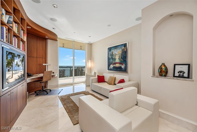 940 Cape Marco Dr Unit 1603, Marco Island, FL 34145 - living area with built in study area, a wall of windows, light marble finish flooring, and recessed lighting