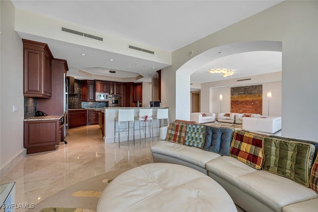 940 Cape Marco Dr Unit 1603, Marco Island, FL 34145 - living area featuring light marble finish floors and arched walkways