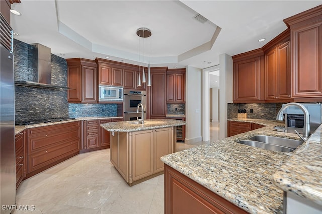 940 Cape Marco Dr Unit 1603, Marco Island, FL 34145 - kitchen with a tray ceiling, wall chimney range hood, stainless steel appliances, light stone countertops, and decorative backsplash