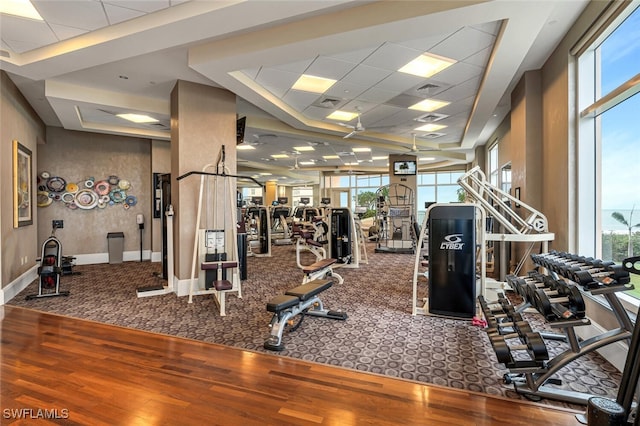 940 Cape Marco Dr Unit 1603, Marco Island, FL 34145 - workout area with wood finished floors, healthy amount of natural light, and carpet floors