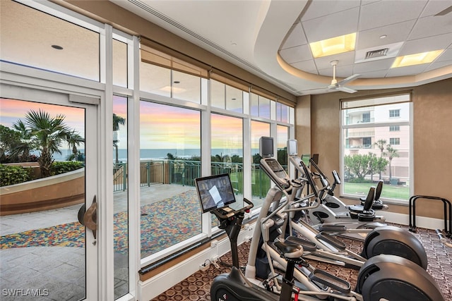 940 Cape Marco Dr Unit 1603, Marco Island, FL 34145 - workout area featuring a water view and a tray ceiling