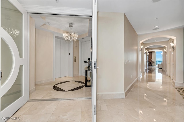 940 Cape Marco Dr Unit 1603, Marco Island, FL 34145 - entryway with arched walkways, a chandelier, marble tiled floors, and recessed lighting