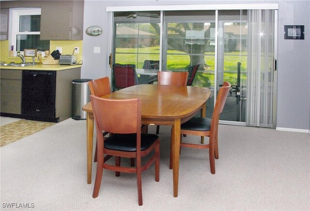 2119 Pellam Blvd, Port Charlotte, FL 33948 - dining room with light colored carpet and baseboards