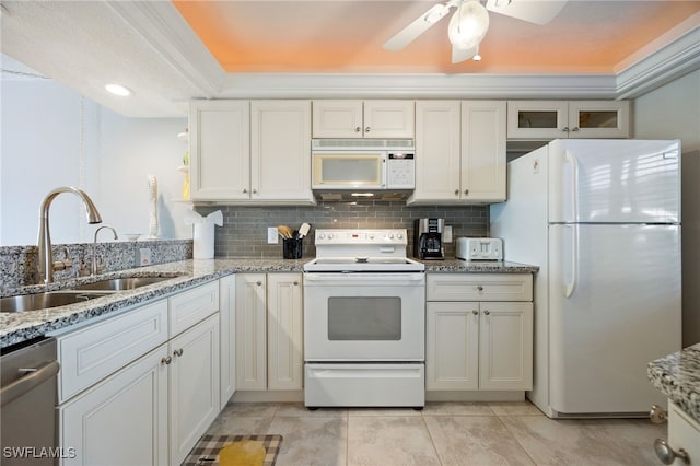4549 SE 5th Pl Unit 109, Cape Coral, FL 33904 - kitchen featuring white appliances, backsplash, light stone counters, ceiling fan, and light tile patterned flooring