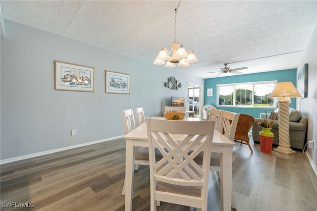 4549 SE 5th Pl Unit 109, Cape Coral, FL 33904 - dining space with a textured ceiling, a chandelier, wood finished floors, and a ceiling fan