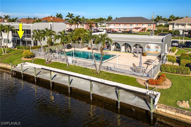 4549 SE 5th Pl Unit 109, Cape Coral, FL 33904 - rear view of house with a residential view and a water view