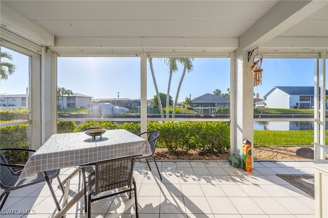 4549 SE 5th Pl Unit 109, Cape Coral, FL 33904 - sunroom / solarium featuring a water view, tile patterned flooring, and a residential view