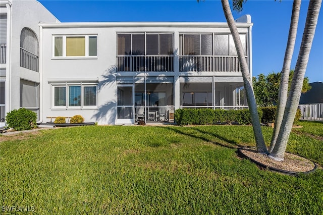 4549 SE 5th Pl Unit 109, Cape Coral, FL 33904 - back of property with stucco siding and a yard