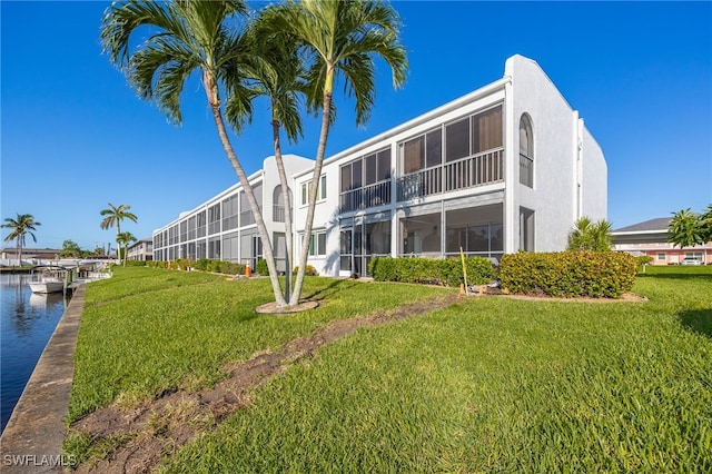 4549 SE 5th Pl Unit 109, Cape Coral, FL 33904 - view of building exterior with a water view