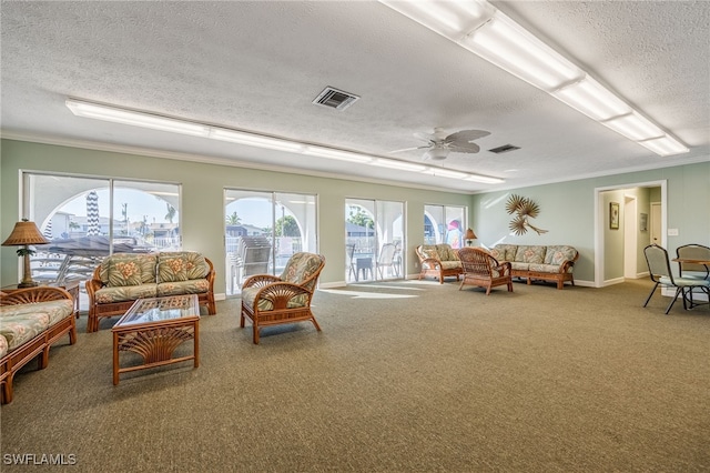 4549 SE 5th Pl Unit 109, Cape Coral, FL 33904 - carpeted living area with a textured ceiling, ornamental molding, and ceiling fan